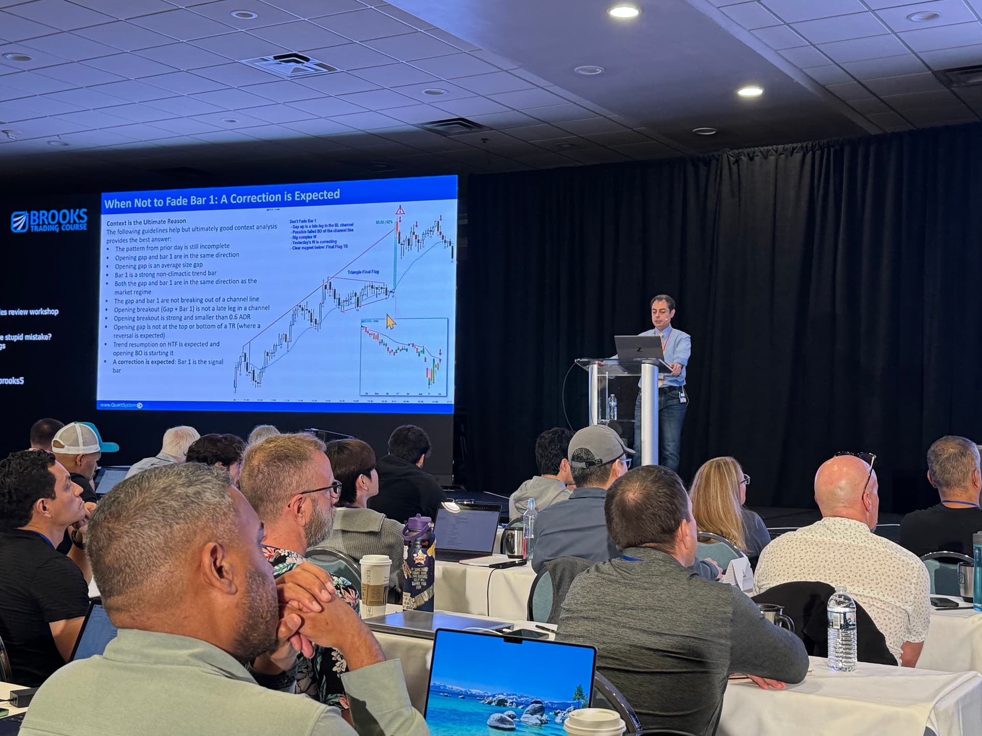 Ali teaching at a professional trading seminar